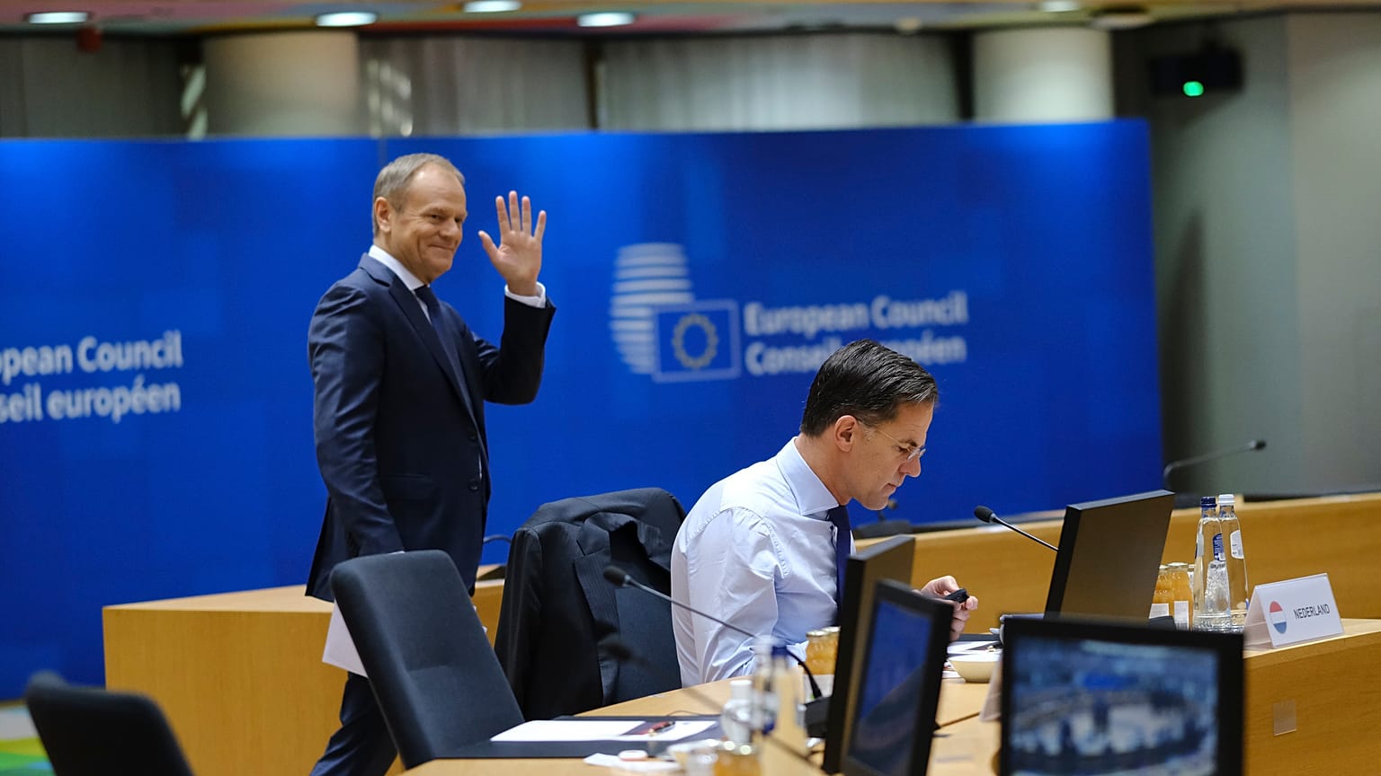 Polish prime minister Donald Tusk behind Dutch counterpart Mark Rutte on 15 December at a European Council summit just days after returning to power.