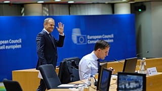 Polish prime minister Donald Tusk behind Dutch counterpart Mark Rutte on 15 December at a European Council summit just days after returning to power.