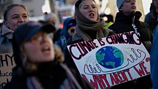Demonstrators shout slogans during a demonstration against the World Economic Forum in Davos, Switzerland, Sunday, Jan. 14, 2024.
