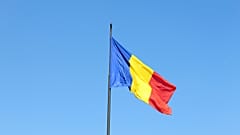 Romanian flag floating in the country's capital city, Bucharest.