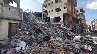   يظهر مخيم البريج للاجئين وسط قطاع غزة وهو مدمر في لقطات جديدة نشرتها وكالة الأنباء الفلسطينية وفا يوم الأحد 14 يناير.