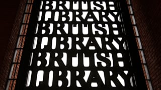 British Library signs are seen over an entrance to the library in London. 