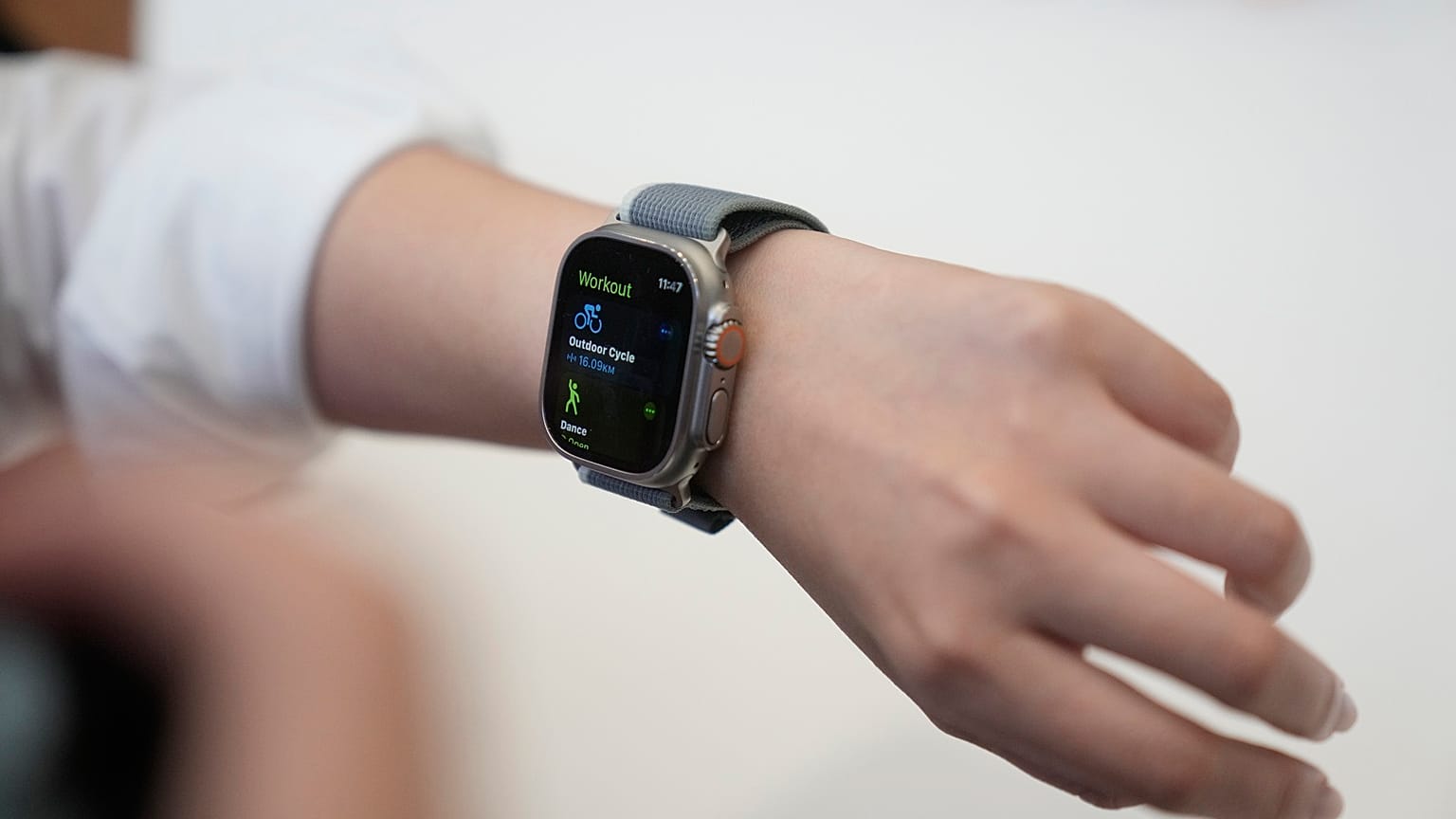 A person tries on an Apple Watch during an announcement of new products on the Apple campus.