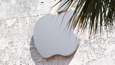The Apple logo is displayed over one of their stores in the US.