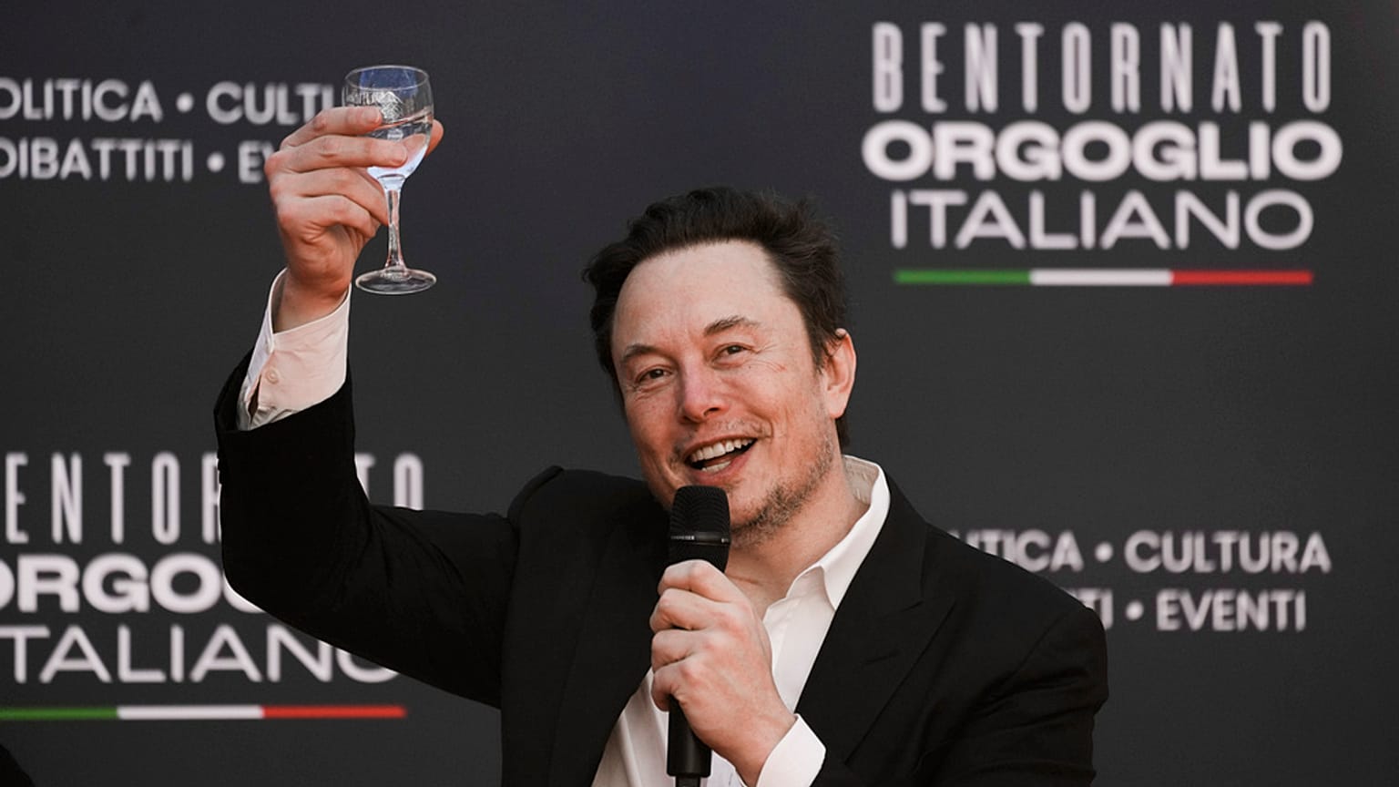 Tesla and SpaceX's CEO Elon Musk cheers as he speaks at the annual political festival Atreju, in Rome on Dec. 16, 2023. 