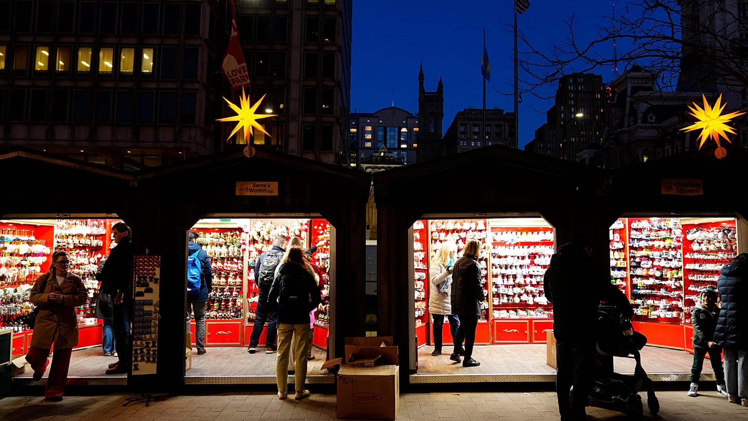 Shoppers visit the Christmas Village in Philadelphia, Dec. 13, 2023. 