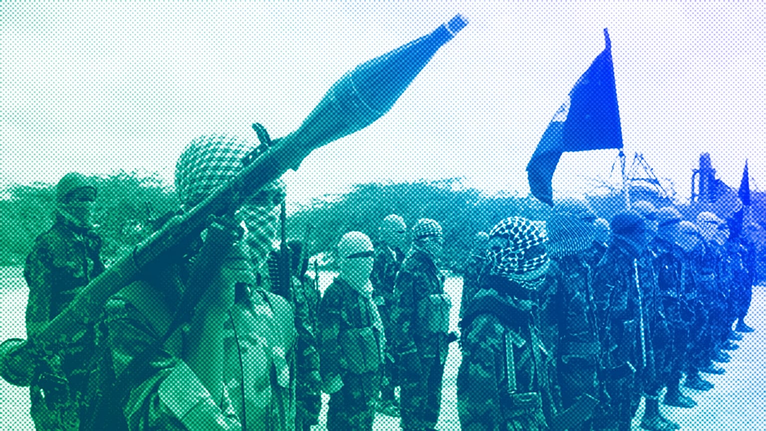 Al-Shabaab fighters display weapons as they conduct military exercises in northern Mogadishu, Somalia, October 2010