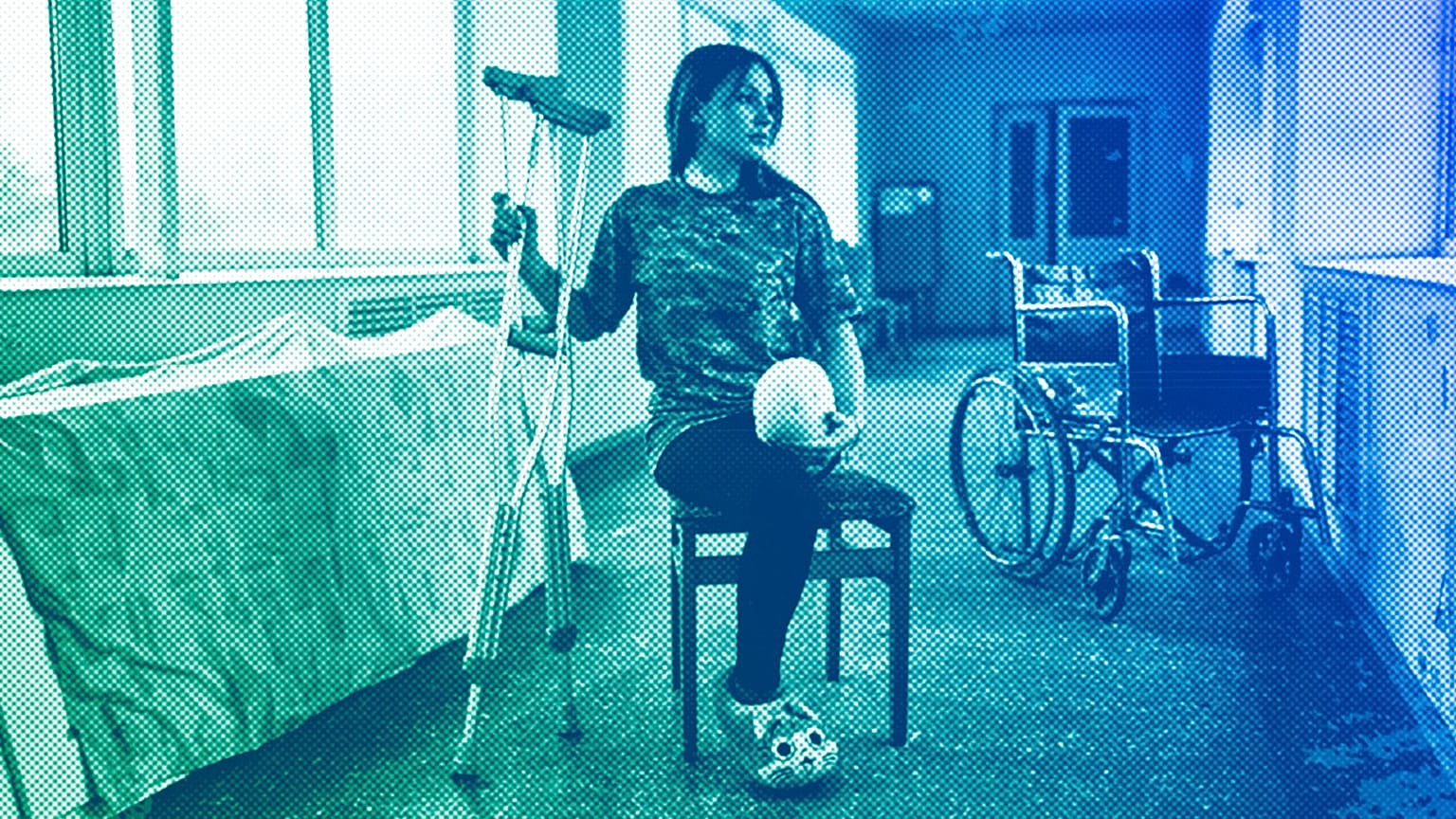 Ruslana Danylkina, 19, a Ukrainian soldier who lost her leg in the fighting near Kherson, holds her crutches in a city hospital in Odesa, February 2023