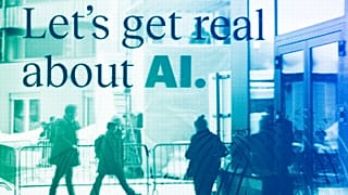 People reflected in a window of a hotel at the Davos Promenade with a slogan about AI alongside the World Economic Forum in Davos, January 2024