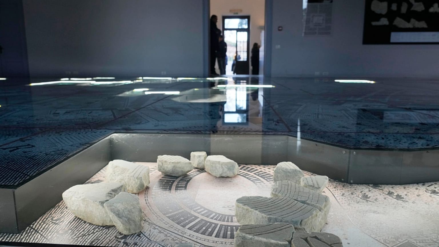 The giant marble map (Forma Urbis Romae) of the ancient Rome is shown to the media in the Archaeological Park of Mount Celio Museum overlooking the Colosseum in Rome