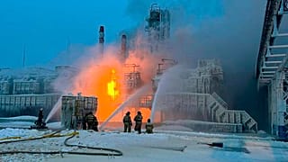 Fire fighters extinguish the blaze at Russia's second-largest natural gas producer, Novatek in Ust-Luga, 165 kilometres southwest of St. Petersburg, Russia on Sunday