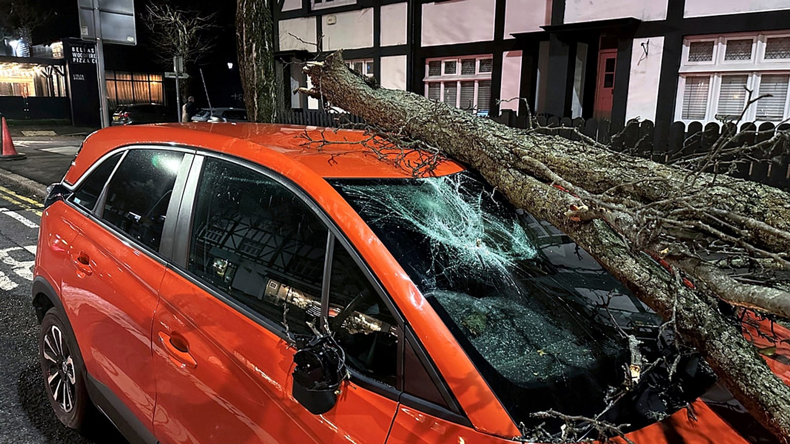 A tree branch fallen on a car on Lisburn Road in Belfast, Northern Ireland, during Storm Isha, Sunday, Jan. 21, 2024.