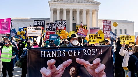 Abortion rights advocates and anti-abortion protesters demonstrate in front of the U.S. Supreme Court, Dec. 1, 2021, in Washington.