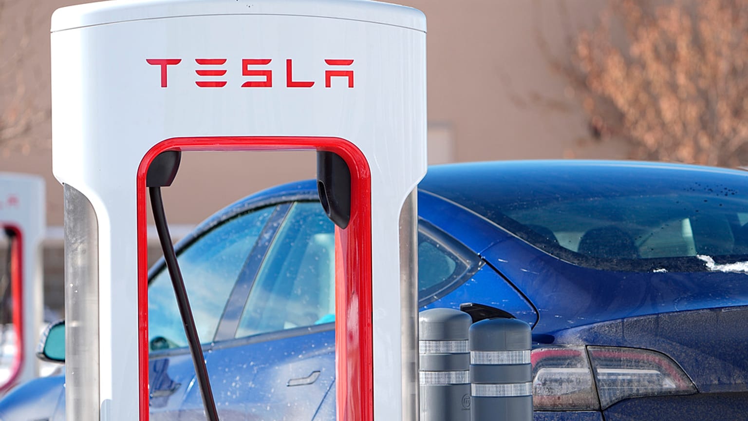 Motorists recharge their Tesla vehicles at a Tesla supercharging location Tuesday, Jan. 16, 2024, in northeast Denver.