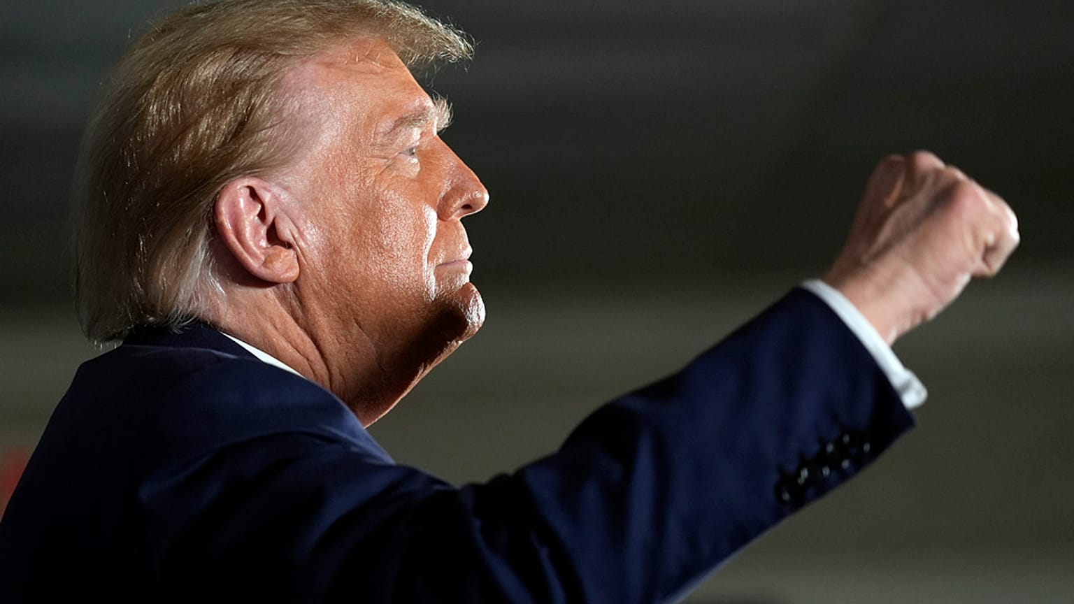 Republican presidential candidate former President Donald Trump gestures as he arrives at a campaign event in Laconia, N.H., Monday, Jan. 22, 2024. 