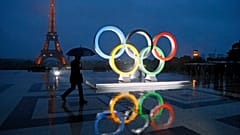 A display of the Olympic rings is set up on Trocadero plaza that overlooks the Eiffel Tower