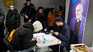 People leave their signatures for Boris Nadezhdin, a liberal Russian politician, who aspires to run for president in March's presidential election, in St. Petersburg, Russia.