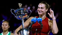 Aryna Sabalenka of Belarus holds the Daphne Akhurst Memorial Cup after winning Australian Open, 27 January 2024