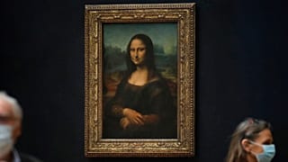 FILE - Journalists walk past Leonardo da Vinci's Mona Lisa during a visit of the Louvre museum Tuesday, June 23, 2020.