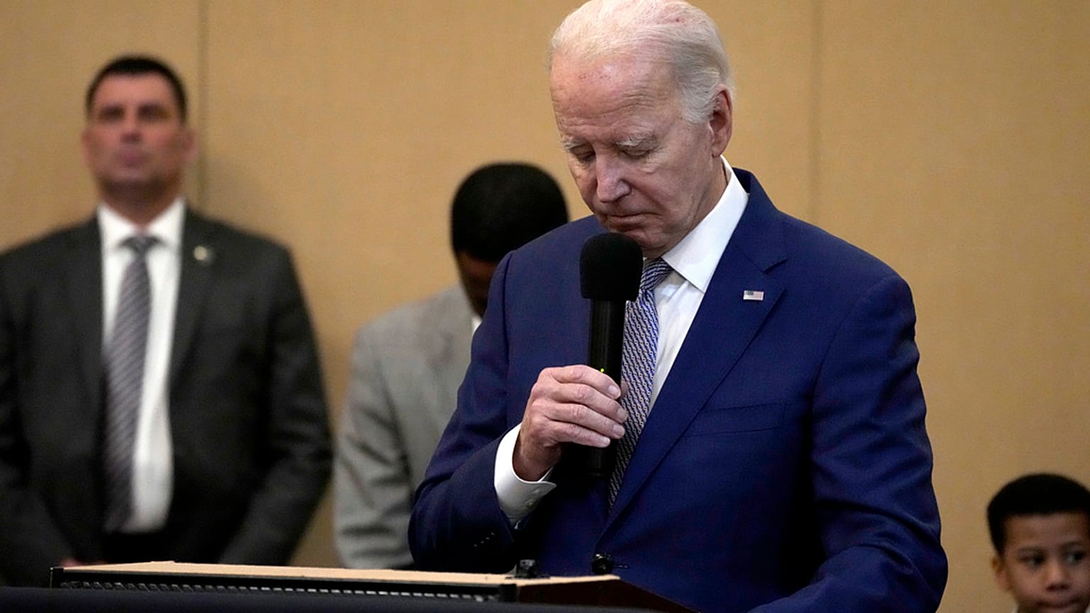 President Joe Biden bows his head in a moment of silence for the three American troops killed Sunday, Jan. 28, 2024