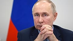 Russian President Vladimir Putin attends a meeting with officials in St. Petersburg, Russia, Friday, Jan. 26, 2024.
