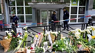 Police officers guard the Vladimir Ribnikar school in Belgrade, Serbia, on May 4, 2023 after a 13-year-old opened fire killing fellow students and a guard.