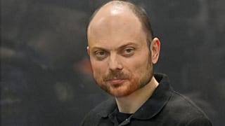 Russian opposition activist Vladimir Kara-Murza stands in a glass cage in a courtroom at the Moscow City Court in Moscow, Russia, Monday, July 31, 2023. 
