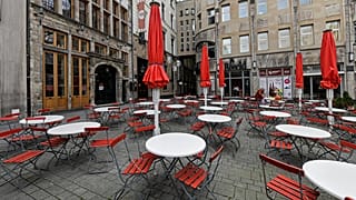 Empty tables in a deserted square in Cologne, Germany. March 18, 2021.