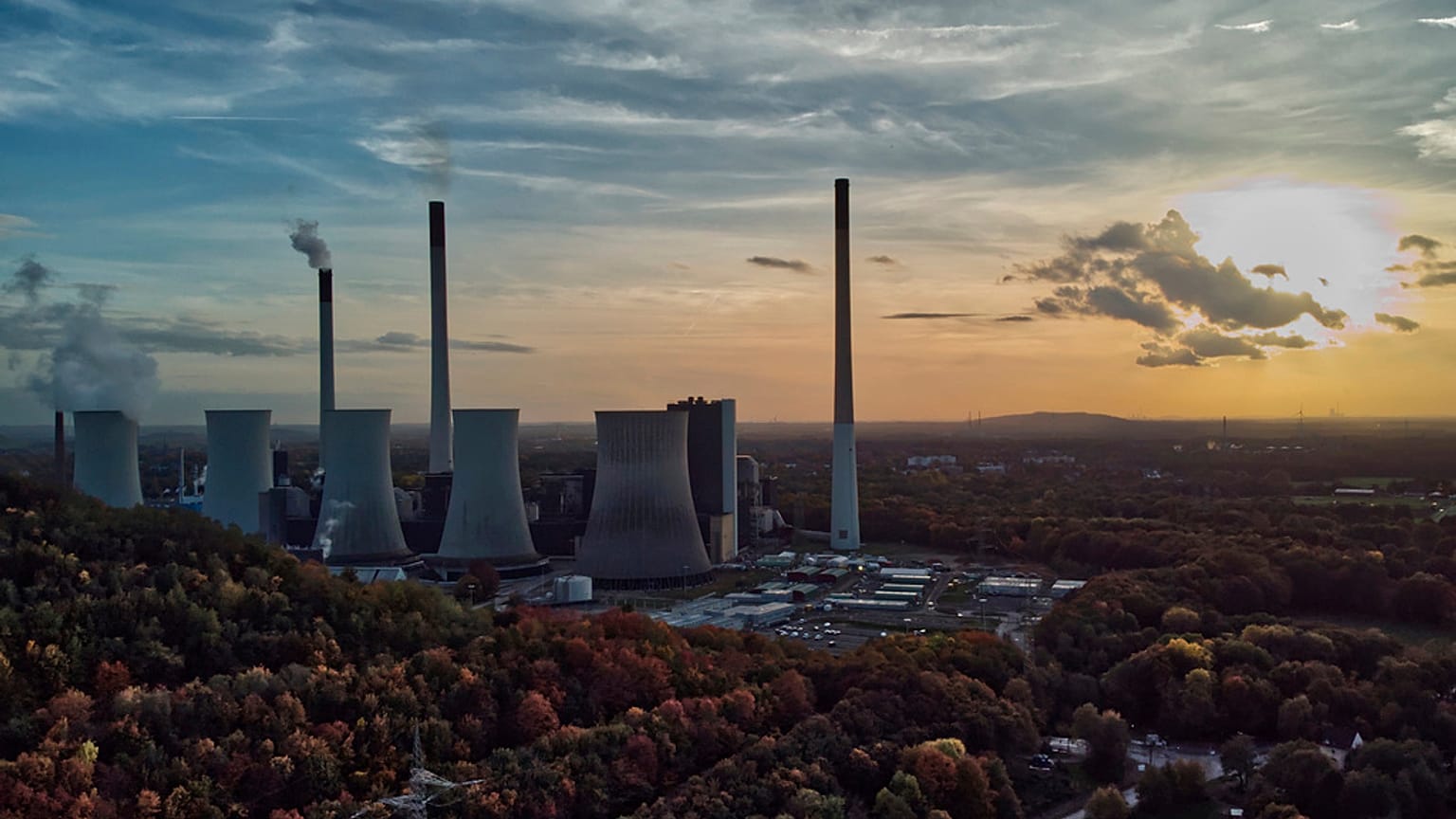 The sun sets behind the cole-fired power plant 'Scholven' of the Uniper energy company in Gelsenkirchen, Germany, on Oct. 22, 2022.