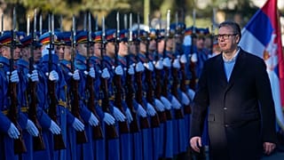 Serbia's President Aleksandar Vučić reviews the honour guard during a welcoming ceremony at the army barracks in Belgrade.