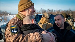 Ukrainian prisoners of war react after a prisoner exchange at an undisclosed location, Ukraine.