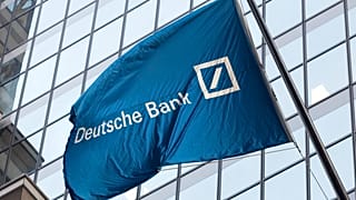 A flag for Deutsche Bank flies outside the German bank's New York offices on Wall Street. Oct. 7, 2016.