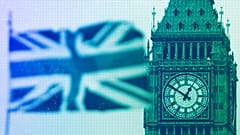 British Union flag waves in front of the Elizabeth Tower at Houses of Parliament containing the bell know as "Big Ben" in central London, March 2017