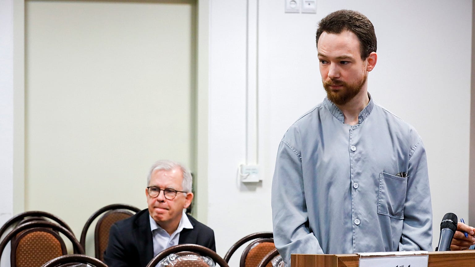 In this photo released by Mizan News Agency on Sunday, Dec. 10, 2023, Swedish citizen Johan Floderus arrives at a courtroom at the Revolutionary Court in Tehran, Iran. 