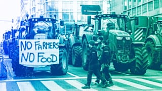 Tractors are parked near the European Parliament during a protest by farmers as European leaders meet for an EU summit in Brussels, February 2024