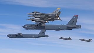 FILE. U.S. B-52H bombers, center, and F-16 fighter jets and South Korean Air Force F-35A fighter jets