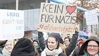 People protest in front of Germany's parliament Reichstag at a demonstration against the AfD party and right-wing extremism in Berlin, Germany, Saturday, Feb. 3, 2024