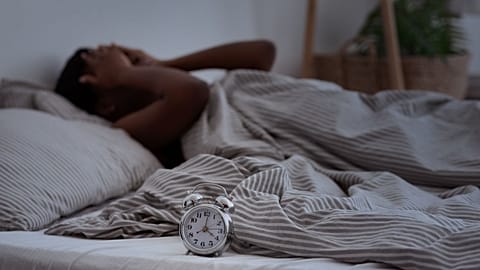 A woman struggling with insomnia.