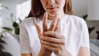 Woman with rheumatoid arthritis, an autoimmune disease. 