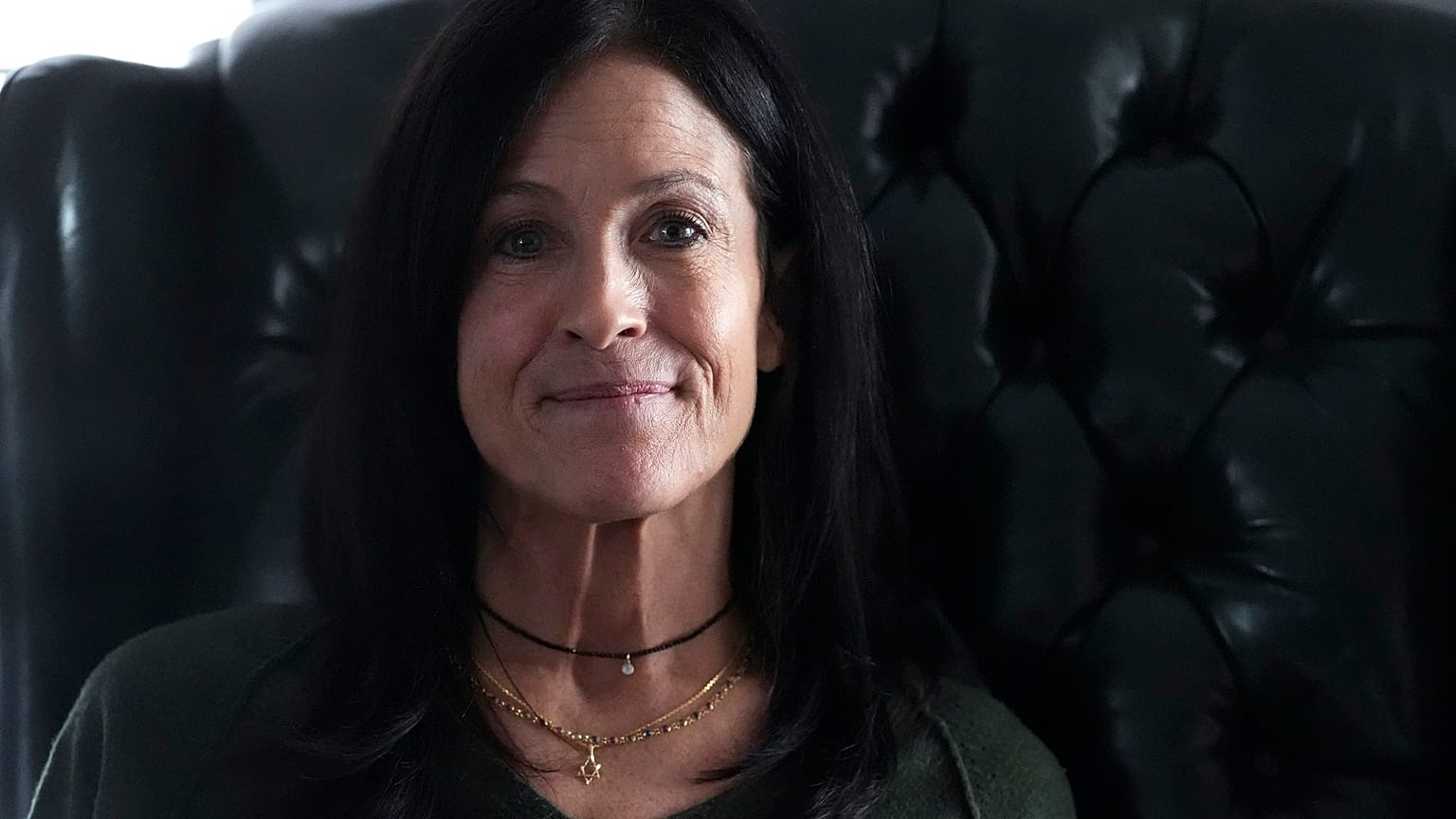 Jill Feldman, 54, poses for a photo at her home in Illinois.