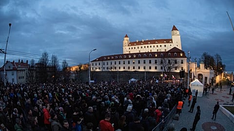 People gather in a protest against a government plan to amend the penal code, in front of the National Council of the Slovak Republic in Bratislava, Feb. 7, 2024. 