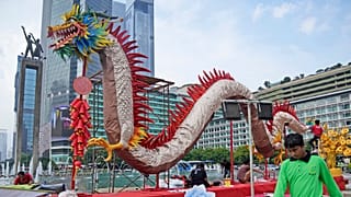 Dragon dancer performs at the opening ceremony of the annual fair at the Temple of the Earth
