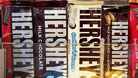 In this Friday, Oct. 7, 2016, photo, Hershey's chocolate bars are displayed on a newsstand, in New York.