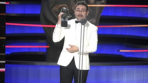 Filmmaker Juan Antonio Bayona holds the Goya for "Best Original Score" on behalf of Michael Giacchino for his work on "The Snow Society," on 10 Feb. 2024.