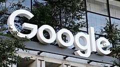 A Google sign hangs over an entrance to the company's new building