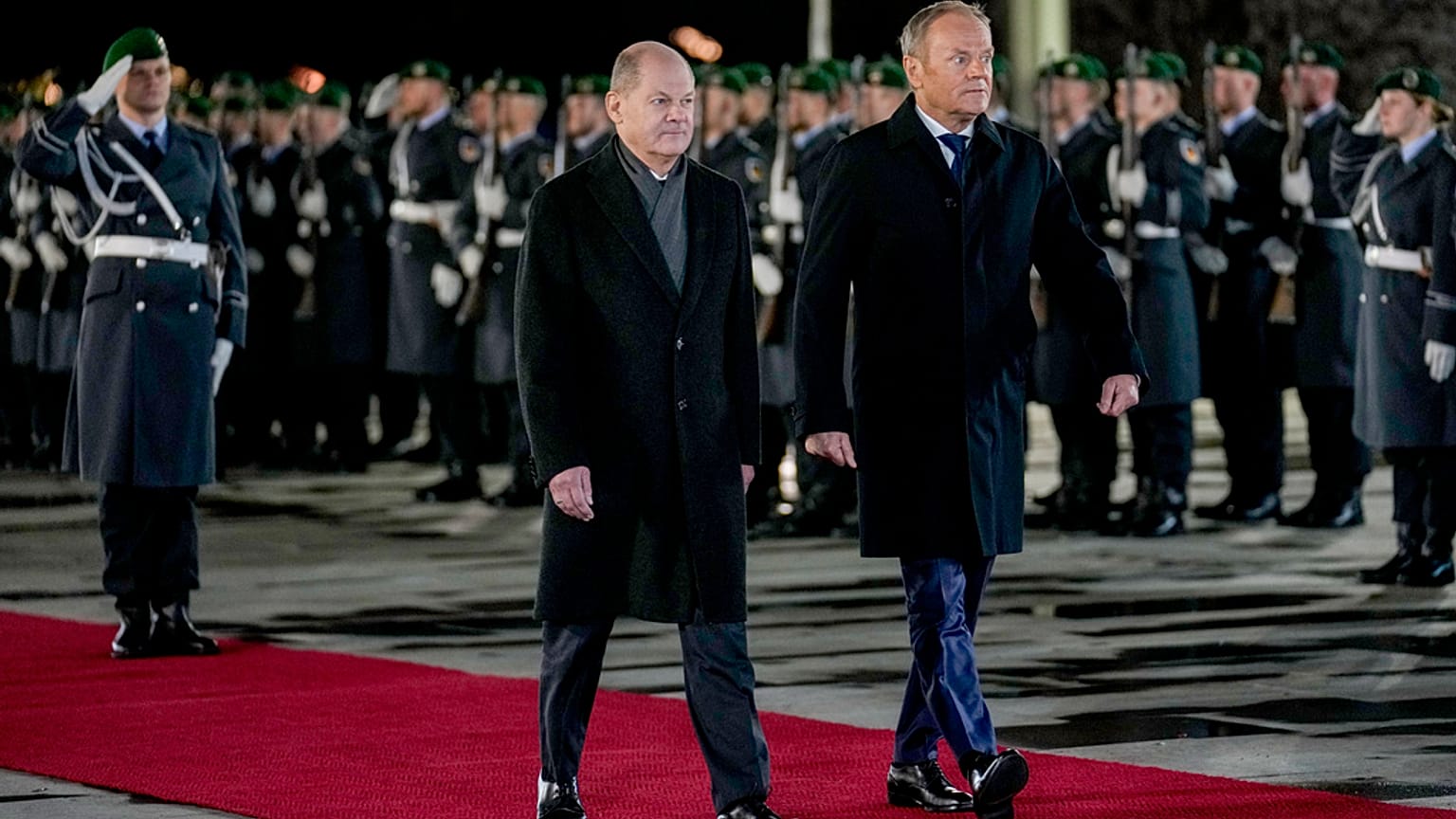German Chancellor Olaf Scholz, left, welcomes Poland's Prime Minister Donald Tusk with military donors in Berlin, Germany, Monday, Feb.12, 2024.