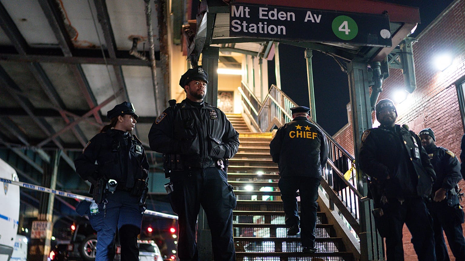 New York City Police officers stand guard following a shooting at the Mount Eden subway station, Monday, Feb. 12, 2024, in the Bronx borough of New York.