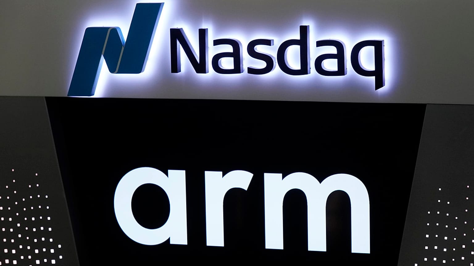 The logos for ARM Holdings and the Nasdaq are shown during the ARM Holdings IPO, in New York's Times Square, Thursday, Sept. 14, 2023.