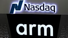The logos for ARM Holdings and the Nasdaq are shown during the ARM Holdings IPO, in New York's Times Square, Thursday, Sept. 14, 2023.
