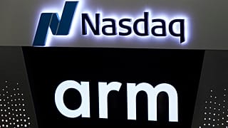 The logos for ARM Holdings and the Nasdaq are shown during the ARM Holdings IPO, in New York's Times Square, Thursday, Sept. 14, 2023.